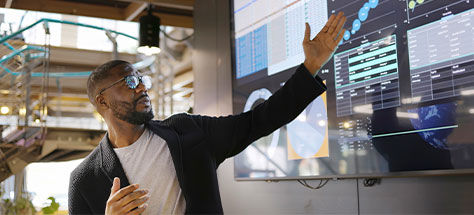 Man Pointing At A Dashboard